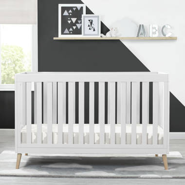 White crib 2025 with wood legs